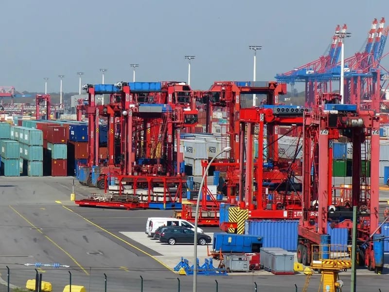 Container cranes loading freight at a port