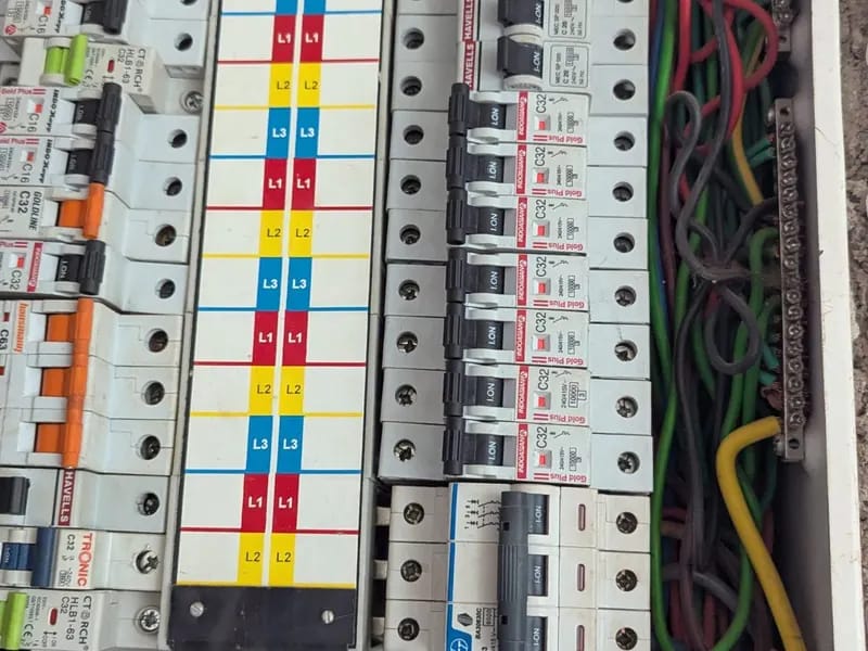 Rows of miniature circuit breakers in a distribution panel